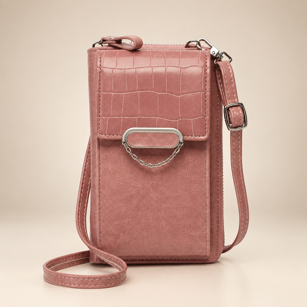 Chain-detail phone shoulder bag on a warm ivory and taupe studio background