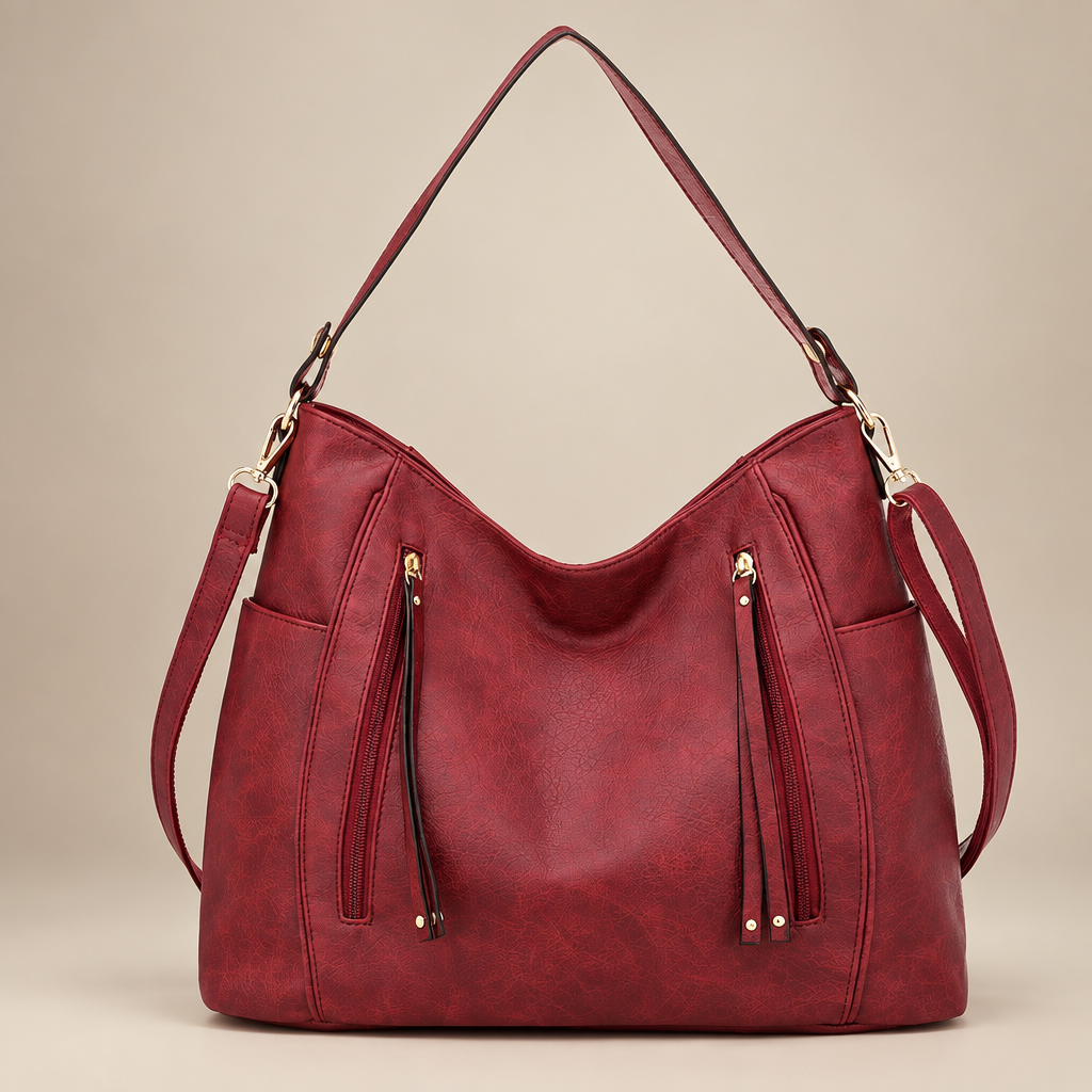 Women's slouchy hobo shoulder bag in red on a warm ivory/taupe studio background
