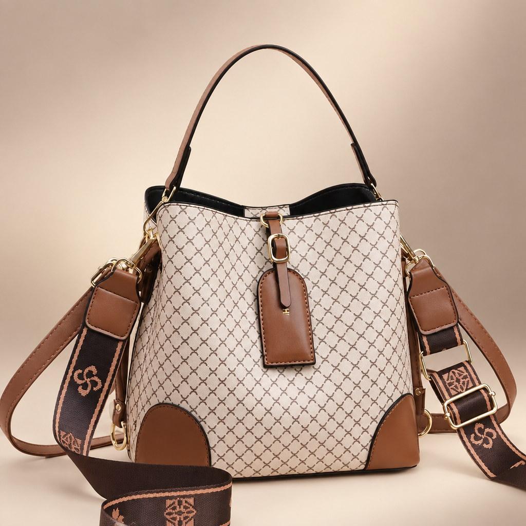 Plaid handbag photographed on a warm ivory studio background
