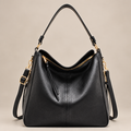 Black hobo shoulder bag on warm ivory studio background, alternate view