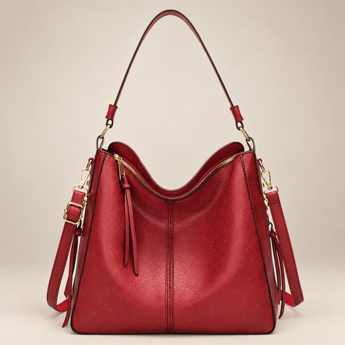 Red hobo shoulder bag on warm ivory studio background