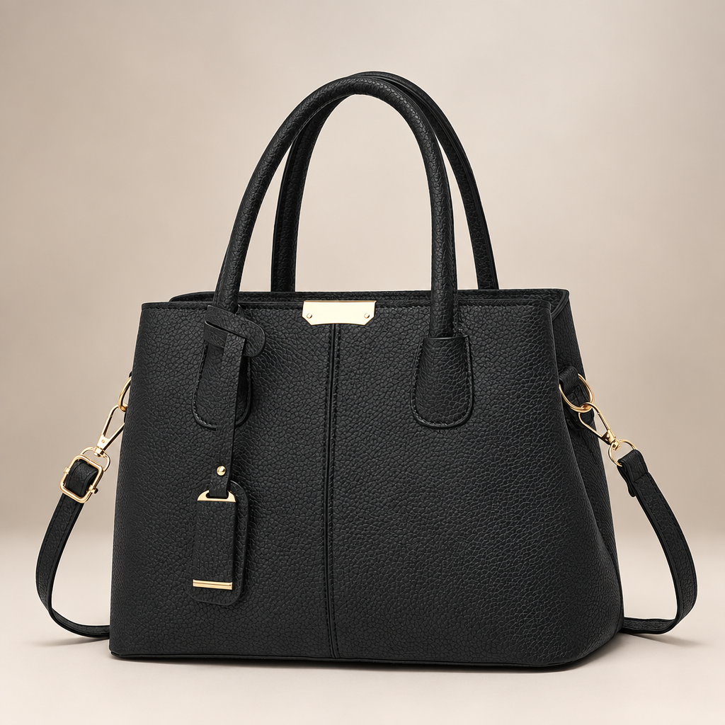 Black tote bag on warm ivory studio background