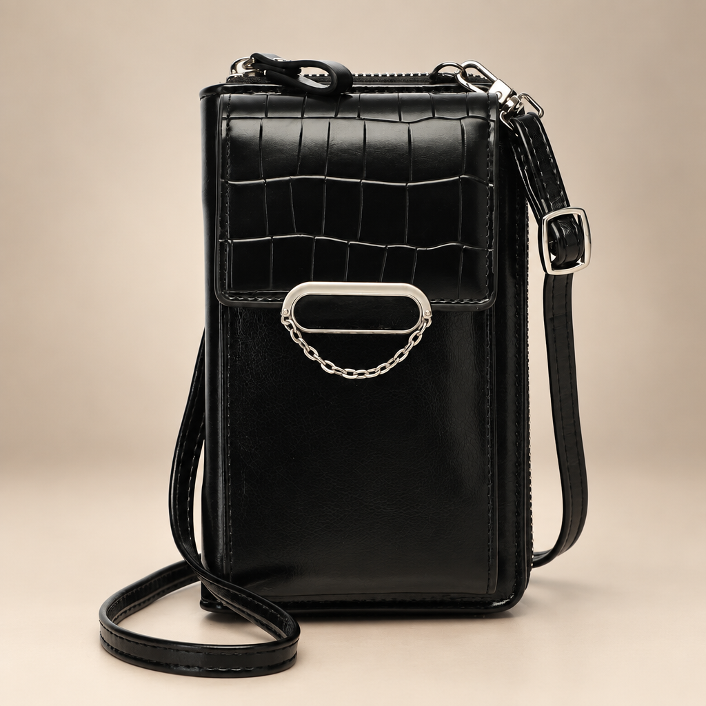 Chain-detail phone shoulder bag on a warm ivory and taupe studio background