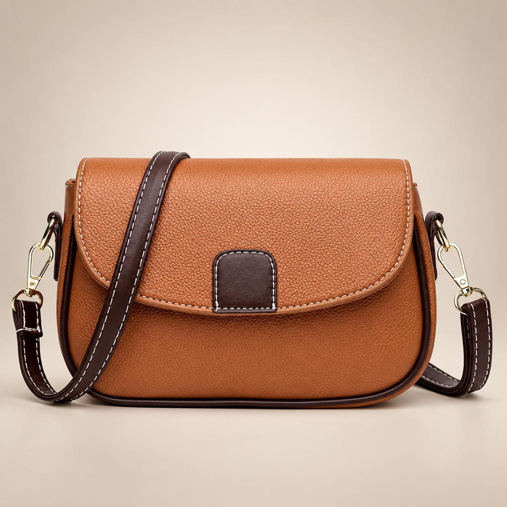 Women's small flap crossbody bag in the yellow colourway on a warm ivory/taupe studio background