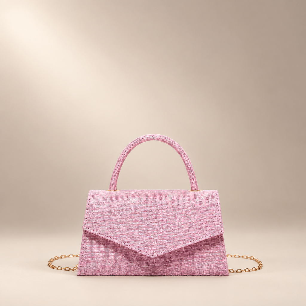 Pink small square PU handbag with a top handle and chain strap on a warm ivory studio background