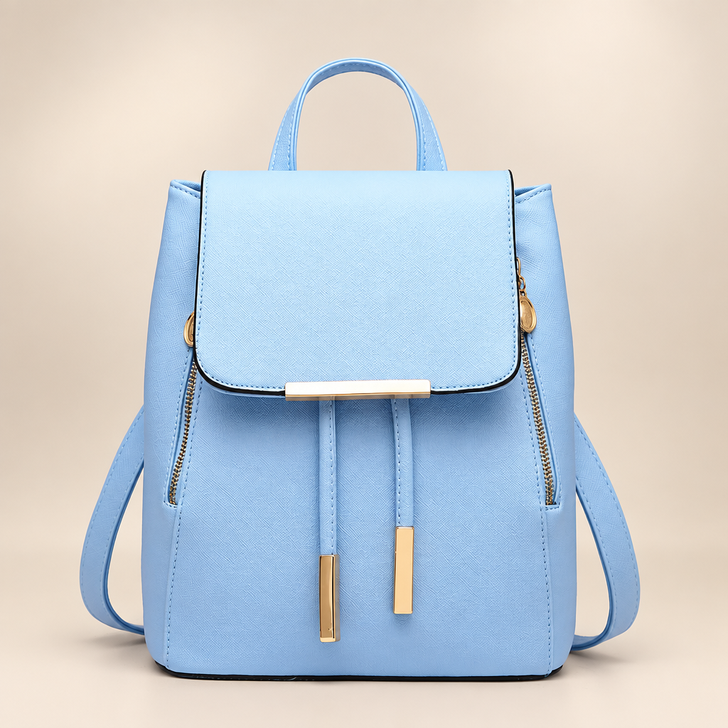 Women's flap backpack in light blue on a warm ivory/taupe studio background