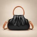 Black pleated bag with tan round handles on a warm ivory studio background