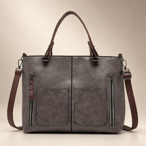 Handbag in a warm ivory and taupe studio setting, front view