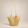 Tan open-weave bucket bag on an ivory studio background