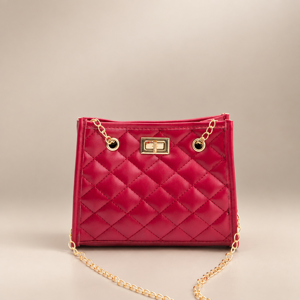 Red quilted mini chain shoulder bag on a warm ivory/taupe studio background