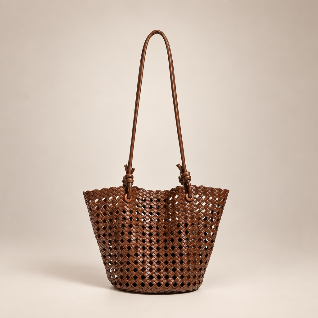 Brown open-weave bucket bag on an ivory studio background