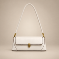 White baguette shoulder bag with gold clasp on a warm ivory studio background