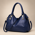 Women's soft hobo shoulder bag in dark blue on a warm ivory/taupe studio background