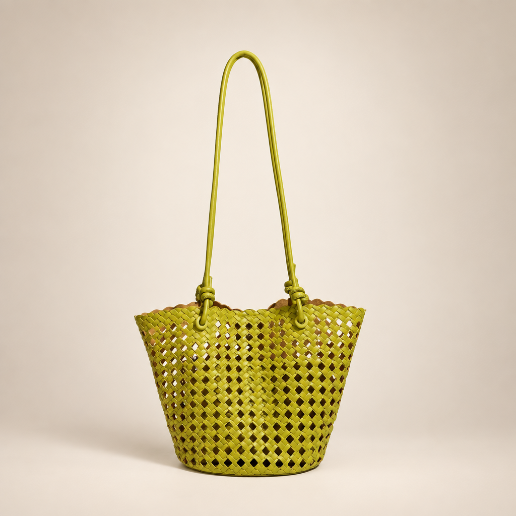 Lime open-weave bucket bag on an ivory studio background