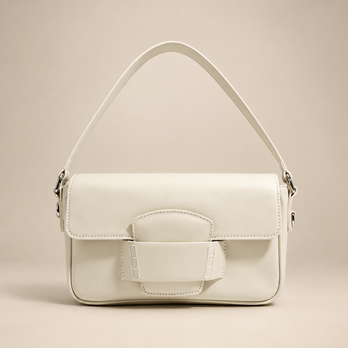 Ivory white flap shoulder bag on a warm ivory studio background