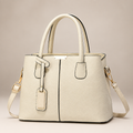 Beige tote bag on warm ivory studio background