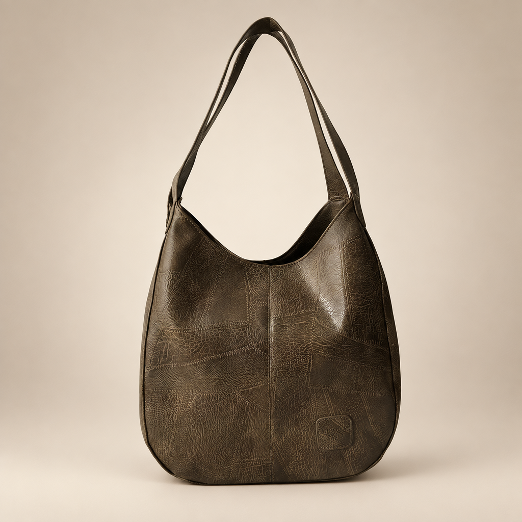 Vintage women's shoulder bag in khaki on a warm ivory/taupe studio background