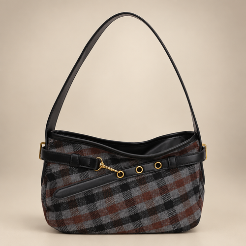 Dark plaid baguette bag with black trim on a warm ivory studio background