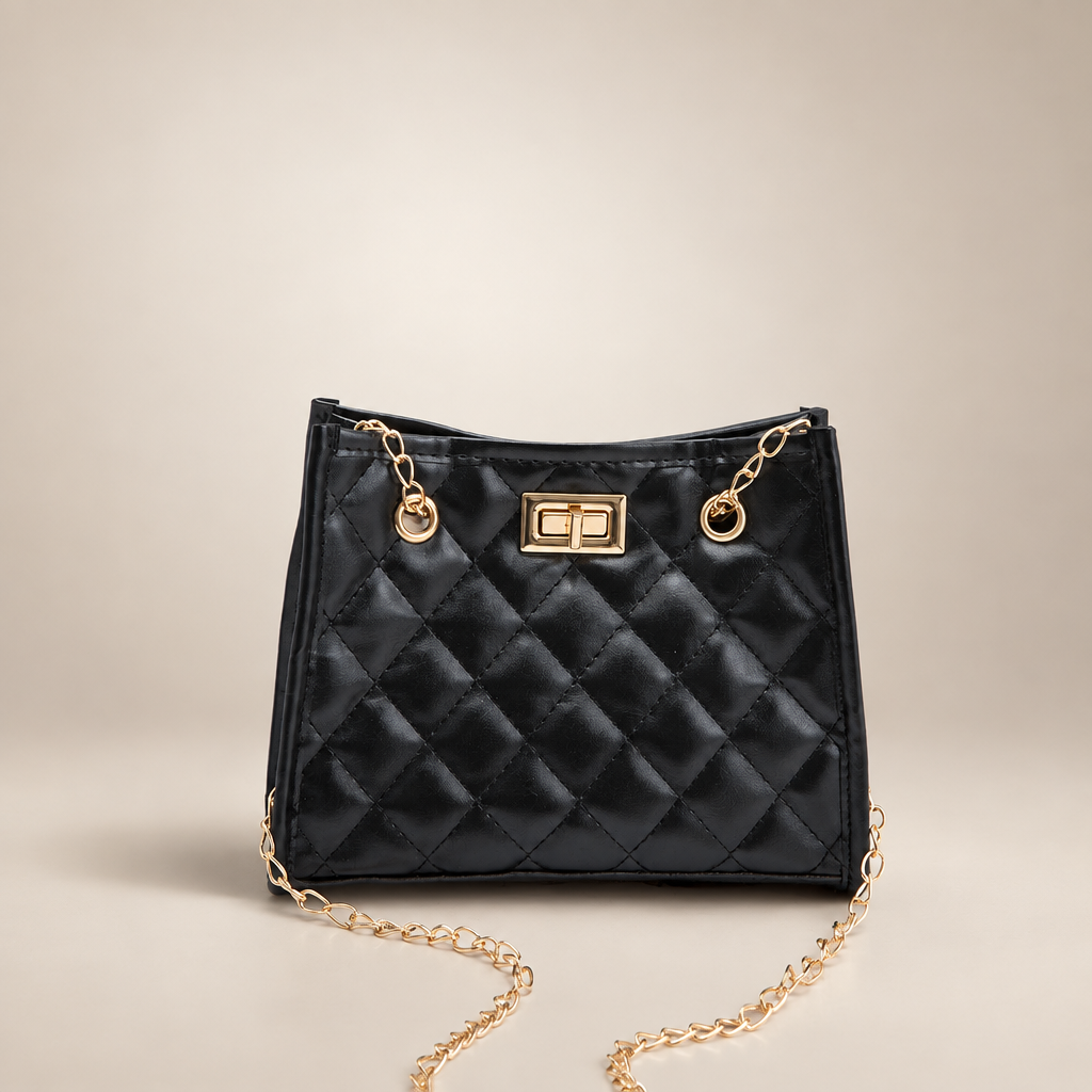 Black quilted mini chain shoulder bag on a warm ivory/taupe studio background